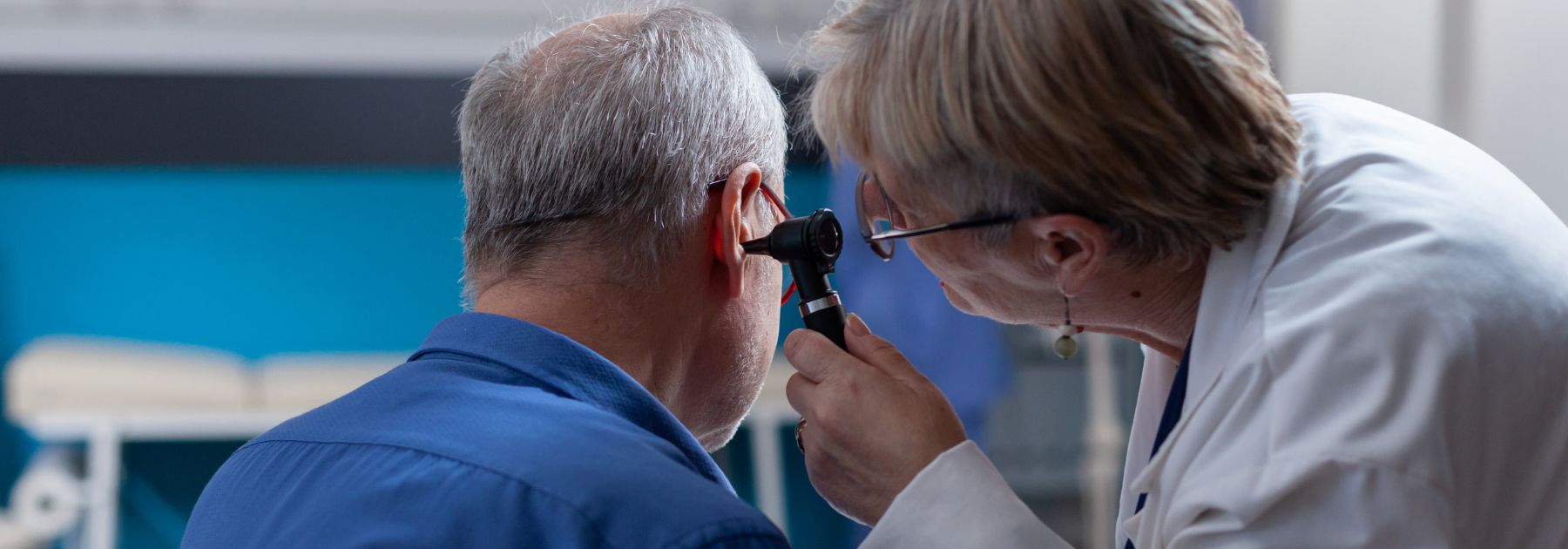 Doctor examining ear